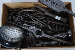 A collection of vintage motorcycle spanners and die sets,