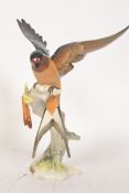 A good continental Hutschenreuther porcelain figurine of a bird, with makers marks to base.
