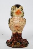 A 20th century Martin Brothers style ceramic figurine of a grotesque bird.