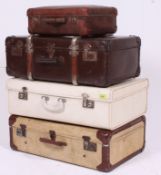 A collection of vintage suitcases dating from the 20th century to also include a small case.