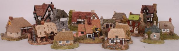 A collection of 15x loose Lilliput Lane model cottages.