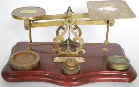 A set of early 20th century Post Office brass weighing scales and weights - with affixed plaque for
