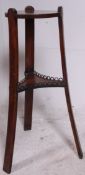 A Victorian Arts & Crafts mahogany plant stant of angular form in the manner of Liberty.