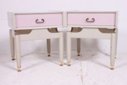 A pair of 1960's retro painted laquered original G-Plan two tone bedside cabinets being raised on
