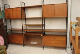 A retro 1970's Modular teak shelving system / bookcase cabinet by Ladderax.