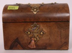 A Georgian domed top walnut stationery box chest, with brass decoration applied to top,