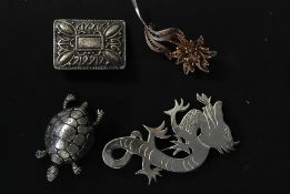 A selection of hallmarked silver brooches to include a dragon,