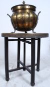 An unusual shaped brass coal purdonium together with a brass and oak folding merchants table