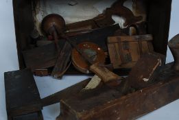 An original vintage military ammunition box, filled with vintage tools (hammers, spanners,
