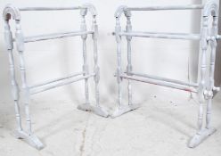 A pair of 20th century shabby chic painted pine towel rails having hoop tops with stretchers to