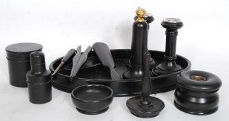 A 20th century ebony wood ladies dressing table set comprising tray, atomiser, candlesticks,
