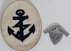 A German Naval Sleeve Insignia for Radio or Signals Operator together with a WW2 German nickel cap