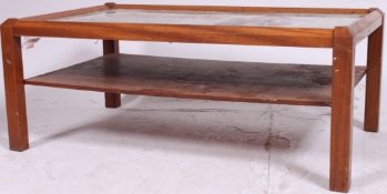 A 1970's retro teak and mirror advertising glass coffee table.