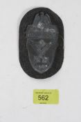 A German Demjansk 1942 battle shield complete with backing plate, on field grey backing.
