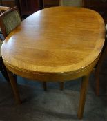 A retro 1970's Nathan teak wood dining table raised on squared legs with shaped supports having