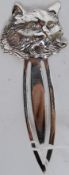 A white metal ( stamped 925 indicating silver ) large bookmark with cat adornment to top