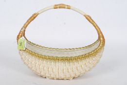 A Royal Worcester blush ivory basket, with gilt decoration,