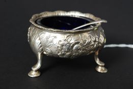 A silver hallmarked ( rubbed ) 19th century table salt raised on hoof feet having blue glass liner