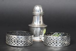 A pair of silver hallmarked napkin rings along with a pepper cruet for London  1911 by Edward