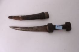 An Asiatic / Islamic dagger complete with the scabbard with Horn handle