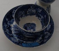 A 19th century Wedgwood blue and white unusual cup and saucer,