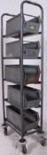 A vintage retro industrial metal tote trays / bins numbered 1 through 5 all stacked neatly on a