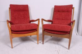 A pair of retro 1970's vintage Cintique armchairs having the original upholstered frames being