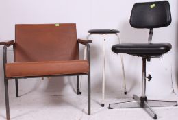 A good machinists industrial 20th century work stool together with a 1960's school teachers room