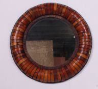 A contemporary large Chinese bamboo wall mirror of circular form having ochre coloured finish