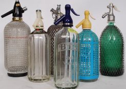 A good collection of vintage and retro soda syphons to include Czech mesh, Spanish,
