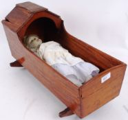 DOLLS; A Victorian bisque headed doll with limbs and a cloth body,