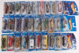 HOTWHEELS; A collection of 30x carded unopened Hotwheels diecast by Mattel. All circa 2000 era.