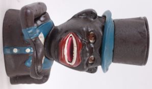 MONEY BOX; A vintage antique style cast iron novelty money box, with moving eyes and arm.