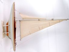 POND YACHT; A vintage model pond yacht, with large white linen sale,