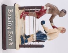 MONEY BOX; A 20th century cast iron automaton style money box / bank in the form of a boxing ring,