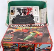 SCALEXTRIC; 2x Scalextric sets - Grand Prix and Metro racing sets. With 3x original cars.