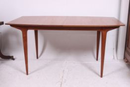A 1970's teak wood retro MacIntosh dinin