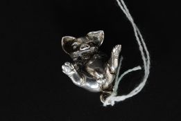 A silver hallmarked pig charm of unusual