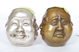 A Japanese bronze paperweight circa 20th Century displaying the four faces of Buddha with inset