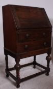 A 1930's oak ladies writing bureau being