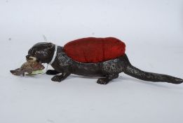 A 20th century cold painted bronze pin c