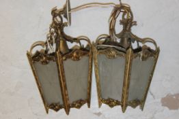 A pair of 20th century rococo gilded met