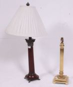 A good quality neo-classical wooden and copper caubel mounted table lamp raised on brass paw feet.