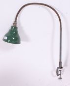 A vintage industrial machinists lamp with pendant shade finished in green with a Goose neck column