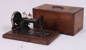A 19th century Victorian Frissher & Rossler sewing machine with gilded decoration complete with the