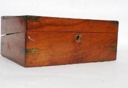 A Victorian walnut and brass bound writing slope box with appointed interior and glass inkwell