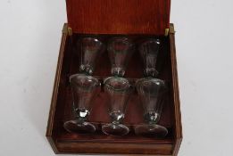 A fabulous mid 20th century firing glass - shot glass set having 6 glasses with green banded