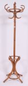 A light bentwood 20th century hat stand having shaped base with hooks atop H190 W69 cm