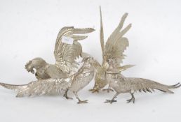 Two pairs of 20th century silver plate pheasants / fighting cocks - each unnamed.