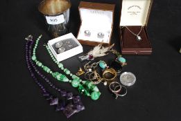 A quantity of costume jewellery to include some 925 / silver rings, white metal necklaces,